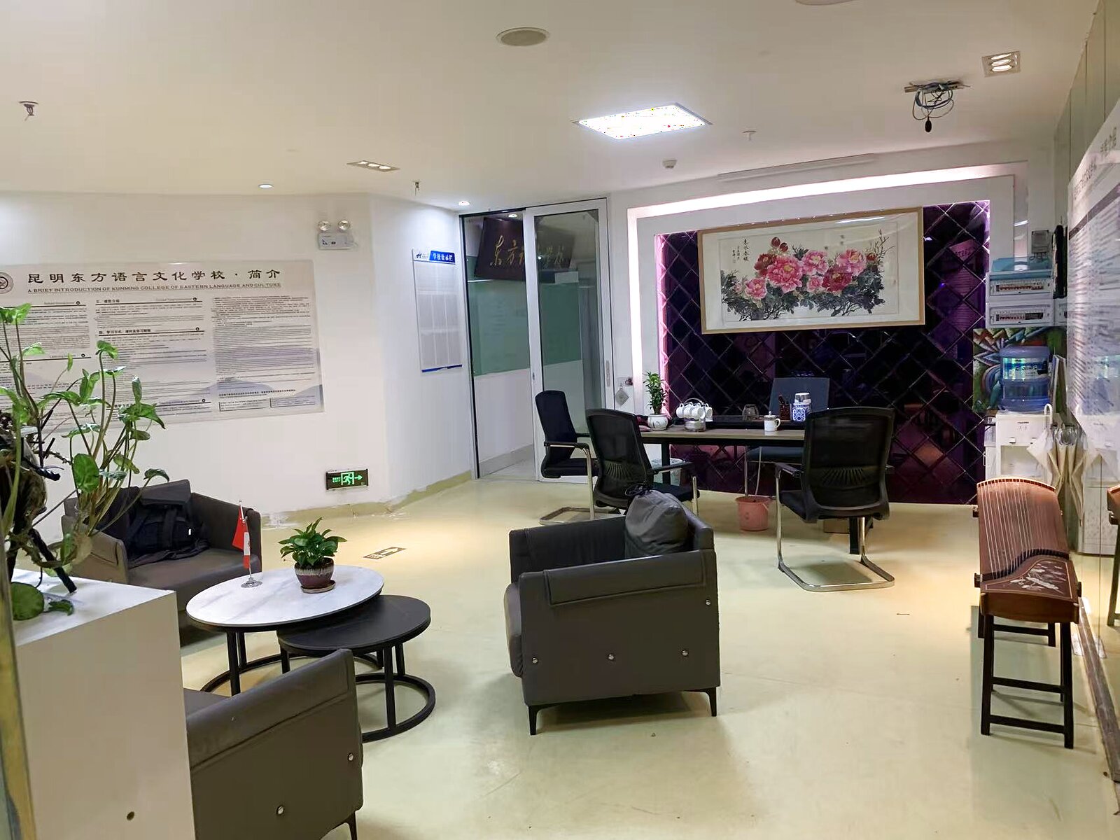 KCEL lounge area featuring a traditional Chinese peony painting and seating