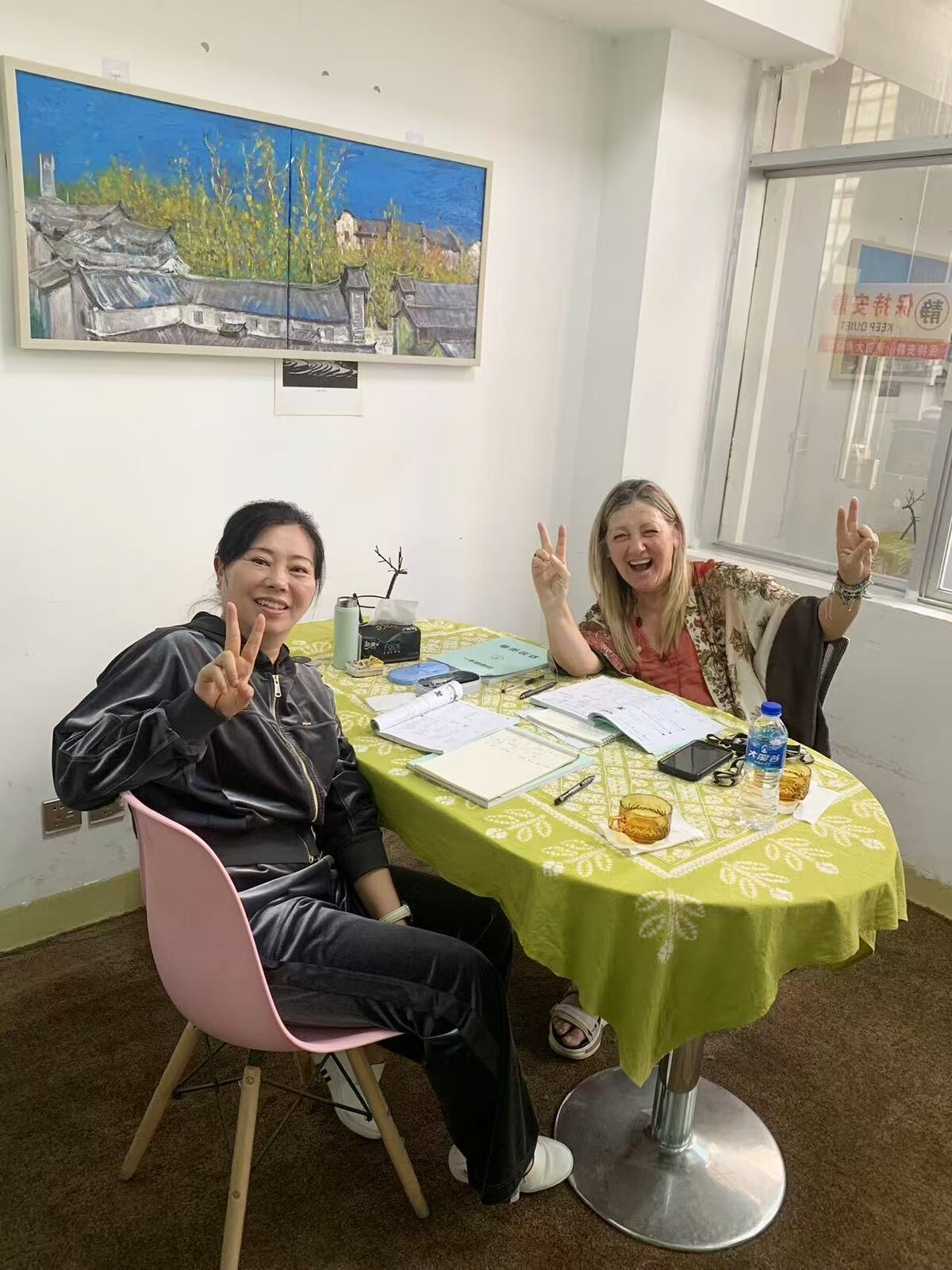 One-on-one Chinese lesson between a KCEL teacher and student in a bright classroom
