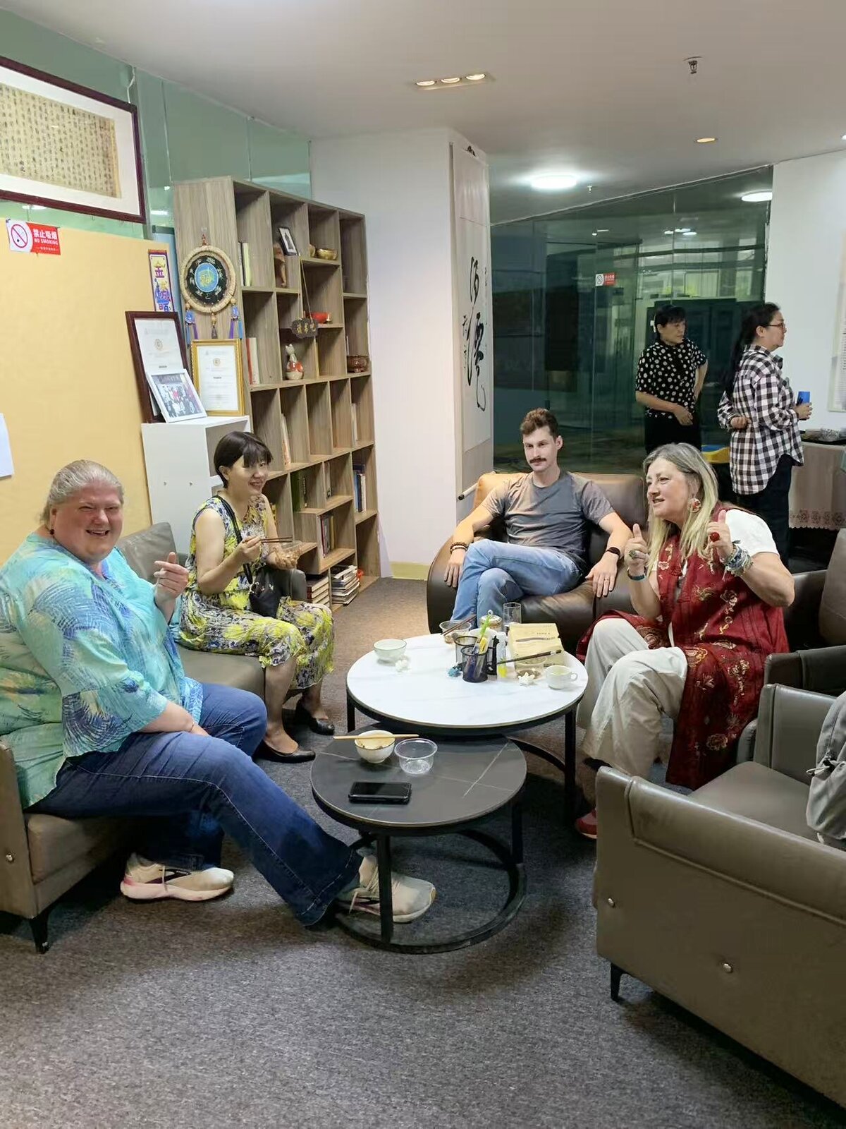 International students and teachers relaxing together in the KCEL common room